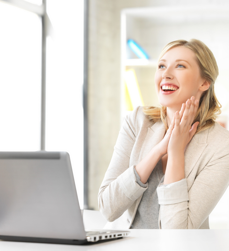 Happy Woman with Laptop Computer